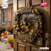 Michigan Wolverines Football Decorative Wreath featuring a mascot, mini helmets, and stadium backdrop on a wooden door.