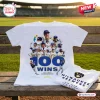 Front view of Milwaukee Brewers 100 Wins White Shirt on wooden bench.