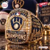Close-up of a Milwaukee Brewers 2026 Champions Championship Ring with gold, blue accents, and embedded crystals.