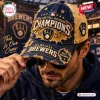 Front view of a man wearing a Milwaukee Brewers 2026 Champions distressed baseball cap with frayed edges.