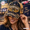 Woman wearing a distressed Milwaukee Brewers 2026 Champions baseball cap with frayed edges and embroidered team graphics.