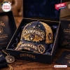 Front view of a Milwaukee Brewers 2026 Champions distressed baseball cap inside a dark blue display gift box.
