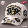 Side angle of a distressed cream cap featuring Milwaukee Brewers 2026 NL Central Champions graphics and patches.