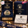 Closeup of a Milwaukee Brewers 2026 NL Central Division Champions commemorative ring displayed in a navy blue box.
