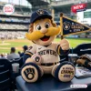 Front view of a plush mascot pillow holding a 2026 NL Central Champions flag in a baseball stadium setting.
