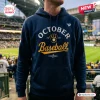 Front view of a navy blue Milwaukee Brewers October Baseball 2026 hoodie with yellow and white lettering.
