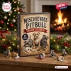 Front view of Mischievous Pitbull Puppy Advent Calendar box with miniature puppy figurines on wooden table.