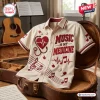 Front view of the Music Is My Medicine Button-Up Hawaiian Shirt resting in an open guitar case.
