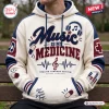 Front view of the Music Is My Medicine Patch Pullover Hoodie in cream with blue and maroon accents.