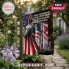 Never Forget 9/11 Patriot Day Memorial Flag featuring a hand holding an American flag and a casualty list in a garden.