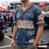 Front view of a distressed blue V-neck T-shirt with vintage-style New England Patriots NFL football team branding.