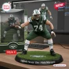 Front view of an acrylic plaque featuring a football player in a green jersey numbered 74 on a grassy base.