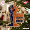 Front view of a trophy-shaped New York Knicks 2026 NBA Champions acrylic ornament hanging on a Christmas tree.