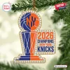 Front view of a New York Knicks 2026 NBA Champions acrylic ornament featuring a basketball trophy with faux rhinestone trim.