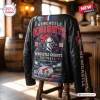 Rear view of the Newcastle Knights Football Black Leather Jacket draped over a wooden stool.