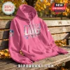NFL 2026 Crucial Catch Pink Hoodie featuring Detroit Lions logo and Intercept Cancer text on a wooden park bench background.