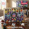 NFL 2026 Football Figurines Advent Calendar featuring 24 team helmets and small player figurines on a wooden table.