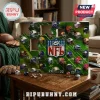 NFL Advent Calendar 2026 featuring team helmets on a green grid with numbered doors sitting on a wooden table.