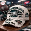 Close-up front view of an NFL Philadelphia Eagles distressed baseball cap on a wooden surface.