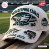 Close-up of a white and green distressed Philadelphia Eagles baseball cap resting on a wooden bench.