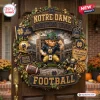 Notre Dame Fighting Irish Football Decorative Wreath with a leprechaun figure, team logos, stadium background, and green decor.