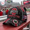 Front view of an Ohio State Buckeyes camo baseball cap with team lettering and a buckeye leaf logo on the brim.