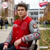 Man wearing Ohio State Buckeyes Football Mascot Baseball Jacket outdoors.