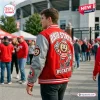 Back view of a person wearing the Ohio State Buckeyes Football Mascot Baseball Jacket outside stadium.