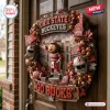 Ohio State Buckeyes Go Ducks decorative wreath featuring Brutus Buckeye, miniature helmets, footballs, and autumn foliage.