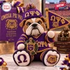 Front view of an Omega Psi Phi bulldog crochet plush toy holding a pennant and wearing a jersey with a crest.