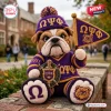 Front view of an Omega Psi Phi bulldog crochet plush toy wearing a purple jersey and holding a matching pennant.