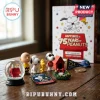 Peanuts 75th Anniversary 24-Piece Christmas Advent Calendar with Snoopy, Charlie Brown figurines, and festive miniatures.