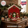 Peanuts Snoopy and Friends Christmas Advent Calendar 2026 house with red exterior, numbered doors, and festive characters.