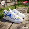 Side view of a Peanuts Snoopy Diabetes Warrior Custom Air Force 1 Sneaker featuring blue ribbons, hearts, and text on a wooden bench.