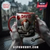 Pennywise IT David Horror Themed Coffee Mug featuring a clown emerging from a drain with a red balloon against rainy backdrop.