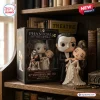 Front view of Phantom of the Opera 40th Anniversary Christine Daaé figure standing beside its commemorative display box.