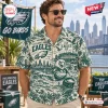 Man wearing a Philadelphia Eagles Fly Eagles Fly Hawaiian shirt with city skyline, stadium, and football motifs.