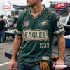 Front view of a distressed dark green Philadelphia Eagles NFL football t-shirt worn by a man at a stadium.