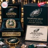 Top view of a Philadelphia Eagles Super Bowl Championship Ring displayed in a dark case with an authenticity certificate.