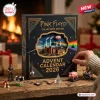 Hand opening a door on the Pink Floyd 2026 Collector's Edition Advent Calendar box with musical figurines.