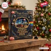 Front view of Pink Floyd 2026 Collector's Edition Advent Calendar on wooden surface near Christmas tree.