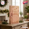 Pink Gnome Christmas 2026 Advent Calendar box with gold foil lettering, ribbon, and numbered compartments on a wooden table.