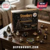 Pittsburgh Steelers Christmas Ornament Advent Calendar 2026 with black and gold holiday decor on a wooden table.
