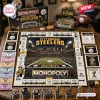 Top-down view of a Pittsburgh Steelers Monopoly board game set with team-themed pieces, currency, and game board layout.