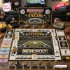 Top view of a Pittsburgh Steelers Monopoly board game with game pieces, currency, and the box on a wooden surface.