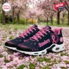 Side view of Pittsburgh Steelers x Breast Cancer Awareness Air Max Plus Sneakers on pink petals.