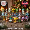 Pokemon 2026 Holiday Advent Calendar featuring twenty-four numbered miniature PVC figures on a wooden floor near a tree.