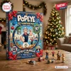Front view of the Popeye 97th Anniversary Advent Calendar box on a wooden table with figurines.