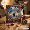 Front view of a Popeye 97th Anniversary Advent Calendar box with character figurines arranged on a wooden table.