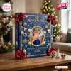 Front view of a blue Princess Diana 65th Anniversary Ornament Advent Calendar with gold trim on a wooden table.